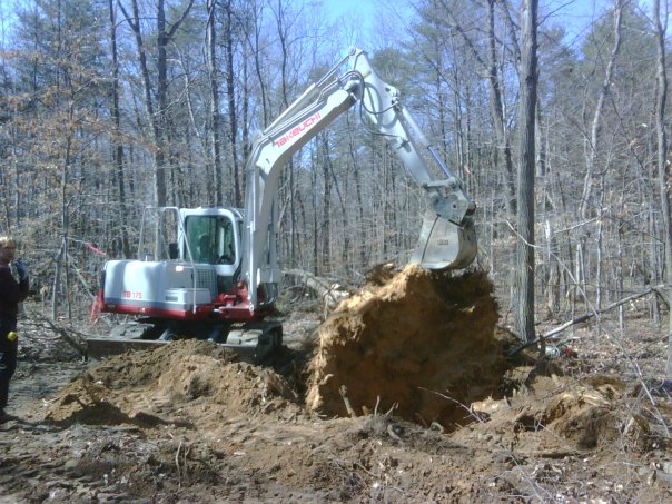Carroll Bros. Contracting Digging out a large poplar stump - Crofton, MD